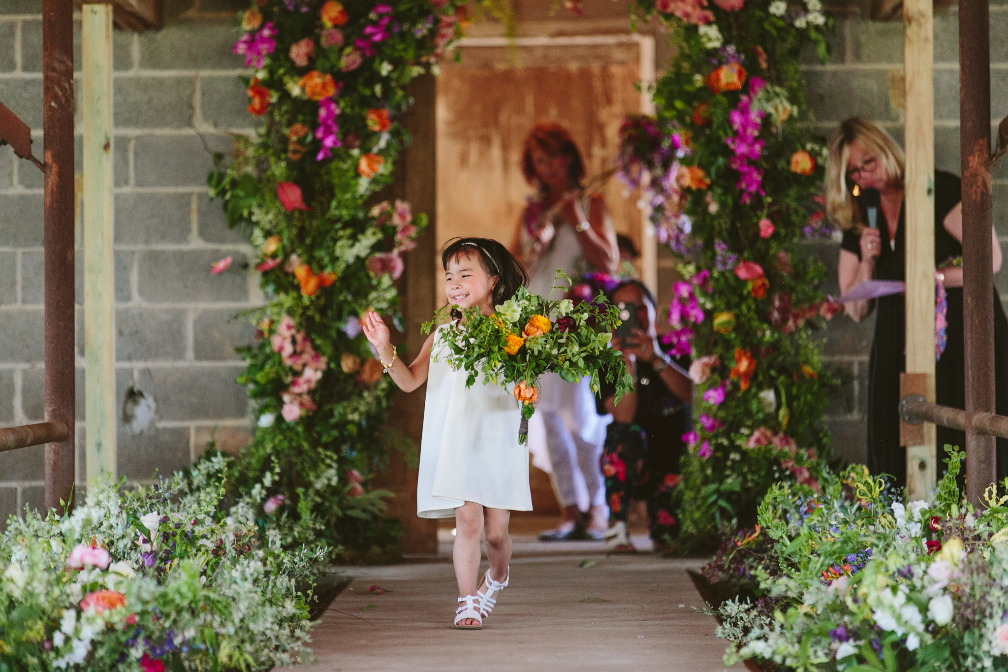 Little one having a blast. I see a proud mom in the background capturing the moment. Bouquet by Jaclyn Millonzi of  Feisty Flowers  in Milwaukee. 